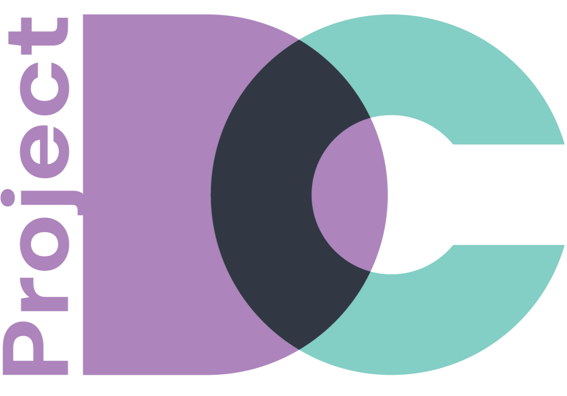 Logo for Project DC, District of Cattleman, powered by the San Antonio Housing Trust. The design features a large stylized D in lavender overlapping a turquoise C, with a dark circular intersection at the center. The word ‘Project’ appears vertically along the left side.